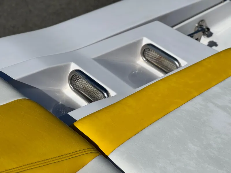 Slide: The Image of 2004 Donzi 38 ZX boat with yellow and white detailing, featuring sleek design elements. - 40
