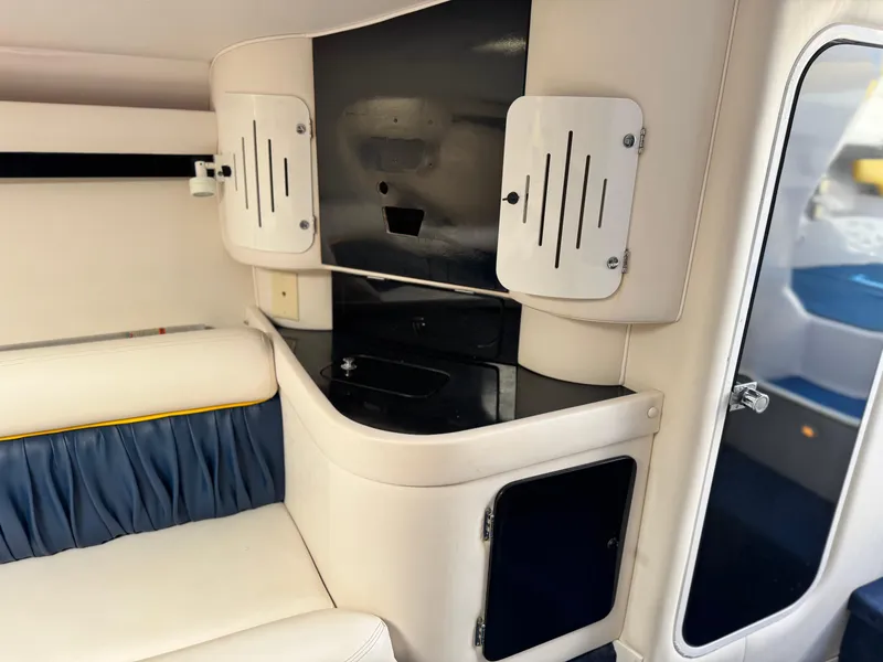 Slide: The Image of Interior of a 2004 Donzi 38 ZX boat, featuring sleek cabinetry and seating. - 54