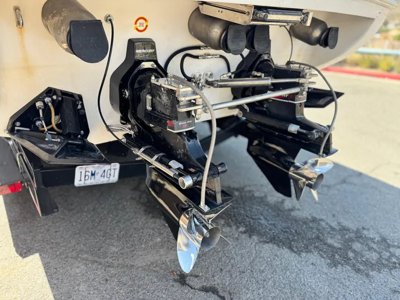 Slide: The Image of 2004 Donzi 38 ZX boat with dual Mercury outboard motors and propellers. - 9