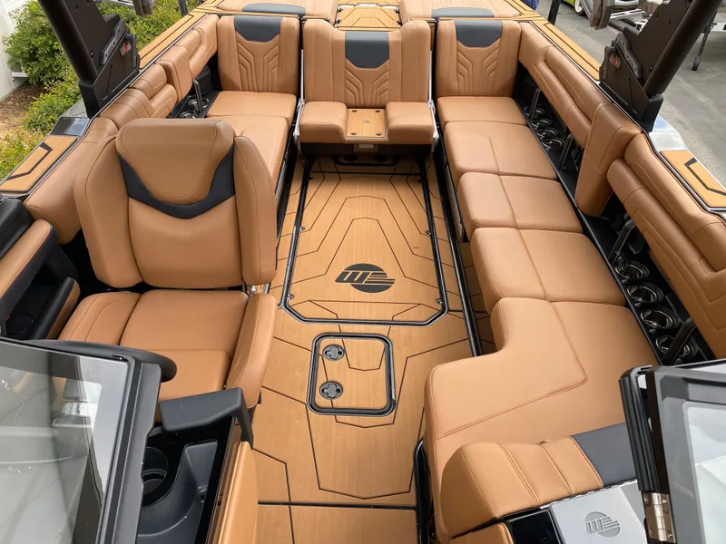 Slide: The Image of Luxurious interior of 2025 Malibu Wakesetter 25 LSV with tan leather seating. - 11