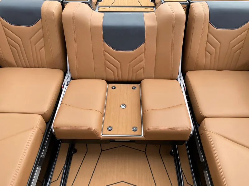 Slide: The Image of 2025 Malibu Wakesetter 25 LSV interior with tan leather seating and sleek design. - 15