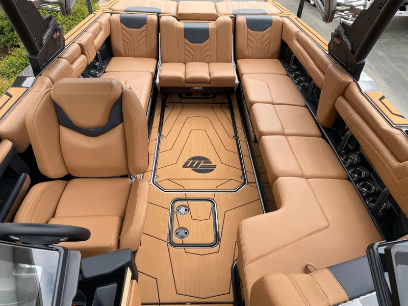 Slide: The Image of 2025 Malibu Wakesetter 25 LSV interior with luxurious tan leather seating. - 19