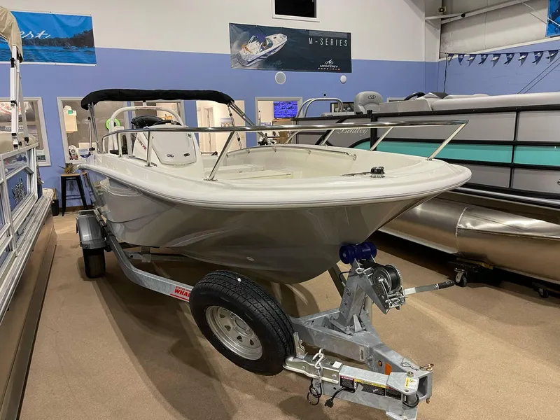 Slide: The Image of 2025 Boston Whaler 160 Super Sport boat on trailer in showroom. - 6