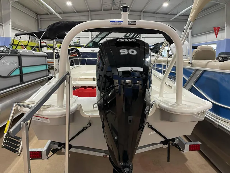 Slide: The Image of 2025 Boston Whaler 160 Super Sport with Mercury 90 engine in showroom. - 8