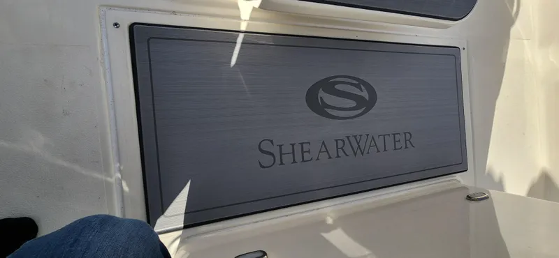 Slide: The Image of 2025 ShearWater 270 SS Open Carolina boat deck with logo. - 18