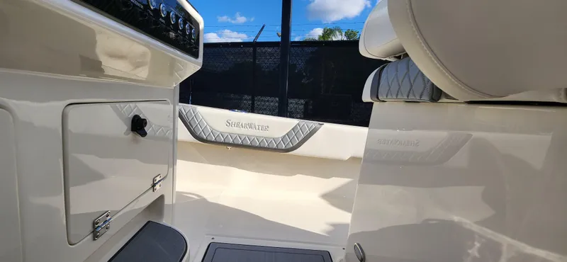 Slide: The Image of 2025 ShearWater 270 SS Open Carolina boat interior with seating and control panel. - 19