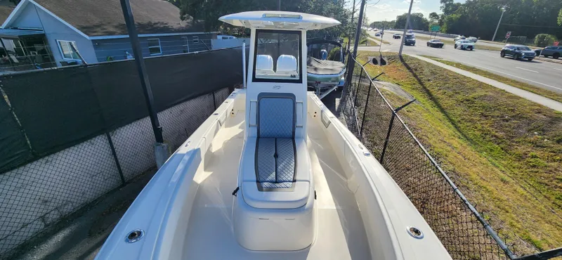 Slide: The Image of 2025 ShearWater 270 SS Open Carolina boat, docked near a road, sunny day. - 24