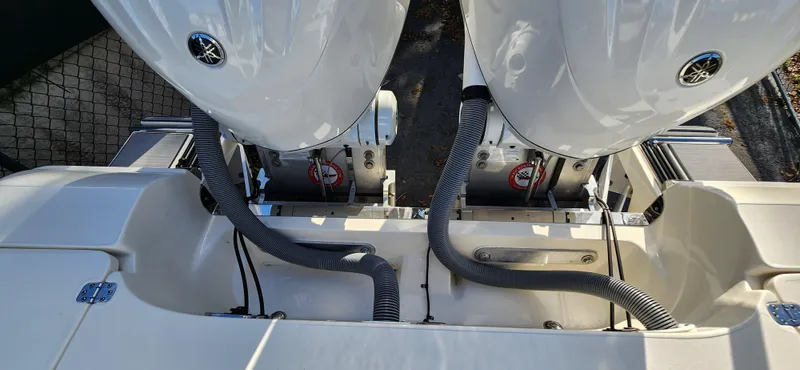 Slide: The Image of 2025 ShearWater 270 SS Open Carolina boat with dual outboard engines, rear view. - 32