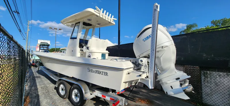 Slide: The Image of 2025 ShearWater 270 SS Open Carolina boat on trailer, parked outdoors. - 33