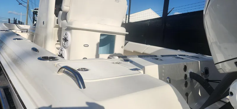 Slide: The Image of 2025 ShearWater 270 SS Open Carolina boat interior with seating and storage compartments. - 5