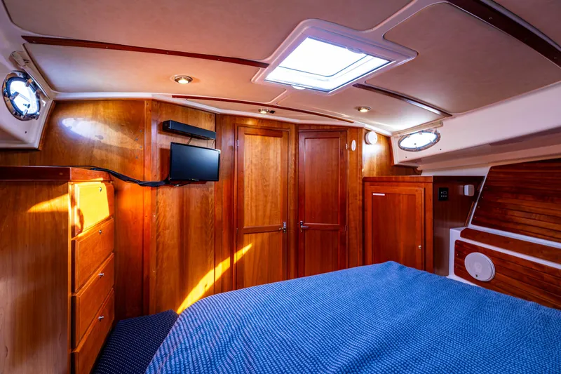 Slide: The Image of Luxurious cabin interior of 2013 Back Cove 37 yacht with wood paneling and skylight. - 24