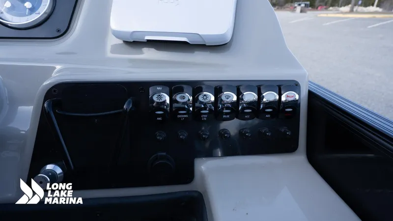 Slide: The Image of Control panel of 2022 Barletta 24UE boat at Long Lake Marina. - 16
