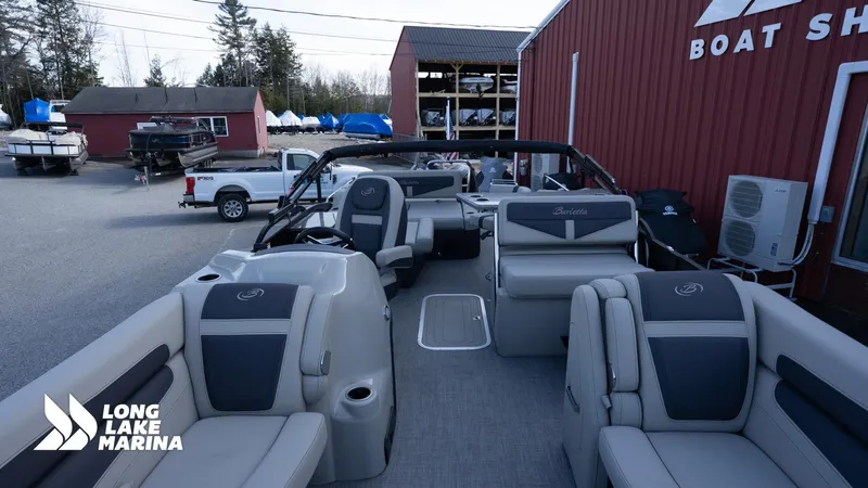 Slide: The Image of 2022 Barletta 24UE pontoon boat at Long Lake Marina, showcasing spacious seating and modern design. - 9