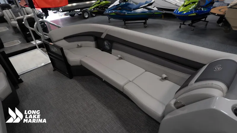 Slide: The Image of 2025 Barletta C24M pontoon boat interior with plush seating at Long Lake Marina. - 10