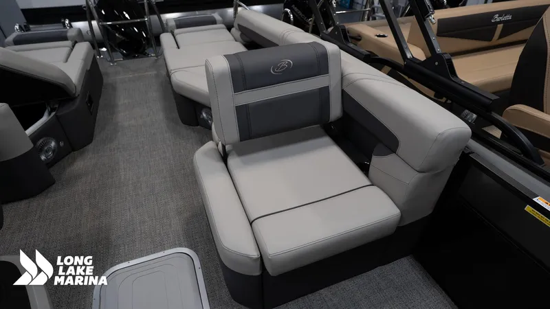 Slide: The Image of 2025 Barletta C24M pontoon boat interior with gray seating and Long Lake Marina logo. - 12