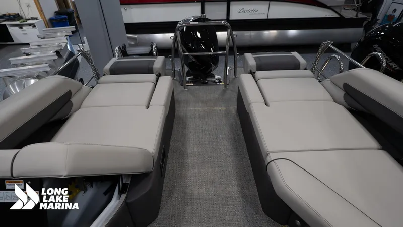 Slide: The Image of 2025 Barletta C24M pontoon boat interior with plush seating at Long Lake Marina. - 14