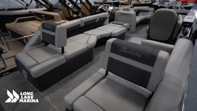 Slide: The Image of 2025 Barletta C24M pontoon boat interior at Long Lake Marina, featuring luxurious seating. - 17