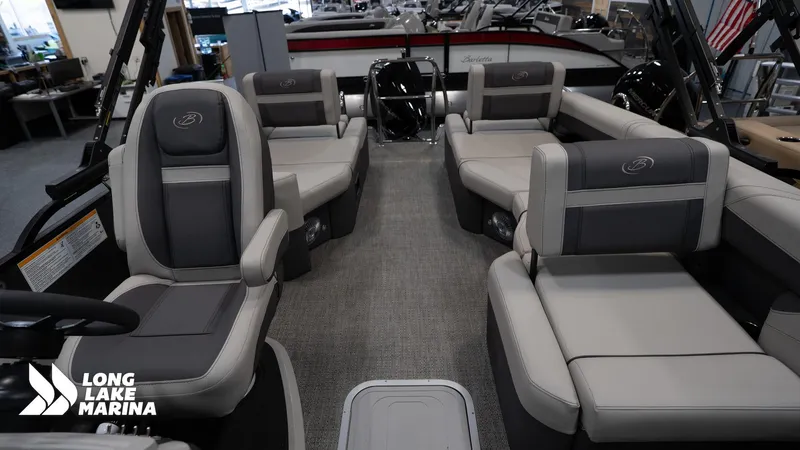 Slide: The Image of 2025 Barletta C24M pontoon boat interior with gray seating at Long Lake Marina. - 18