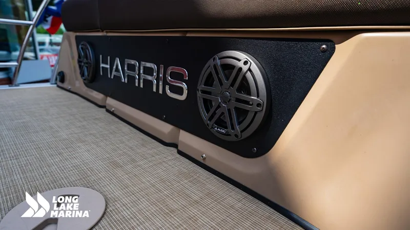 Slide: The Image of 2022 Harris Solstice boat with speakers, Long Lake Marina branding. - 12