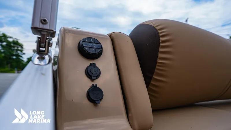 Slide: The Image of 2022 Harris Solstice boat interior with control panel and comfortable seating at Long Lake Marina. - 13