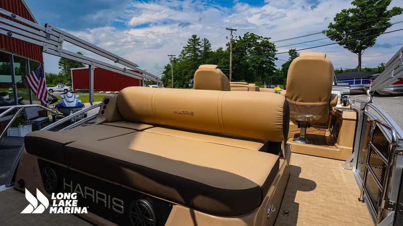 Slide: The Image of 2022 Harris Solstice pontoon boat at Long Lake Marina, featuring tan seating and sleek design. - 2