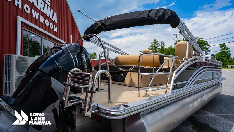Slide: The Image of 2022 Harris Solstice pontoon boat at Long Lake Marina showroom, featuring a powerful Mercury Verado engine. - 3