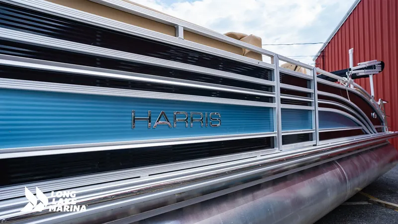 Slide: The Image of 2022 Harris Solstice pontoon boat with blue and silver detailing at Long Lake Marina. - 6