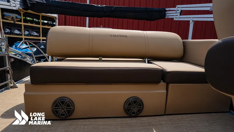 Slide: The Image of 2022 Harris Solstice boat seating at Long Lake Marina, featuring tan and brown upholstery. - 8