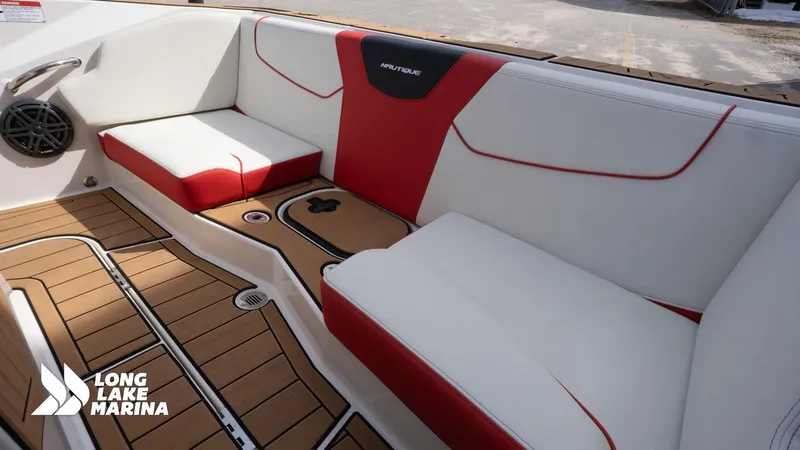 Slide: The Image of 2025 Nautique 200 boat interior with red and white seating at Long Lake Marina. - 15