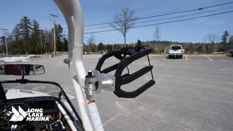 Slide: The Image of 2025 Nautique 200 boat with wakeboard rack at Long Lake Marina parking lot. - 17
