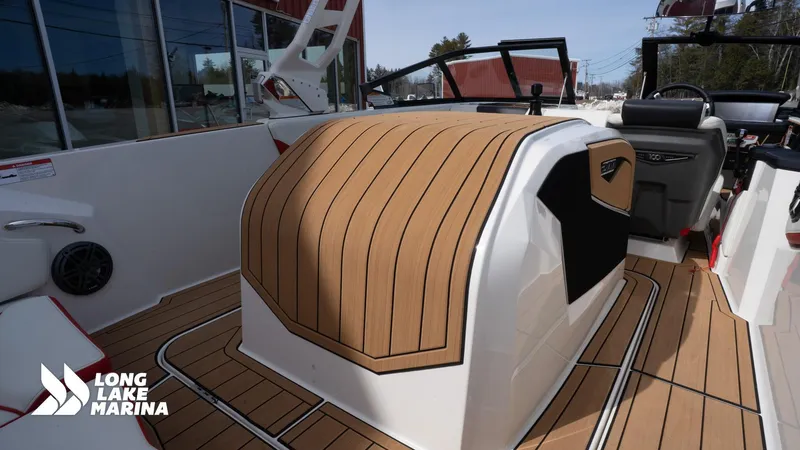 Slide: The Image of 2025 Nautique 200 boat interior with teak flooring at Long Lake Marina. - 18