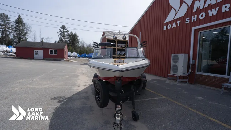 Slide: The Image of 2025 Nautique 200 boat on trailer at Long Lake Marina showroom. - 3