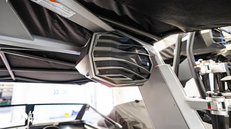 Slide: The Image of 2025 Nautique G23 boat speaker system under black canopy. - 11
