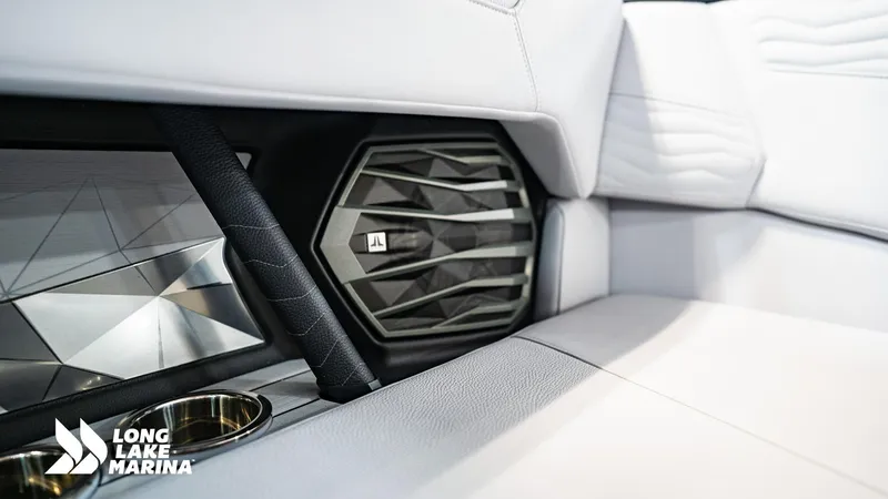 Slide: The Image of 2025 Nautique G23 interior with premium speaker and luxurious seating at Long Lake Marina. - 6
