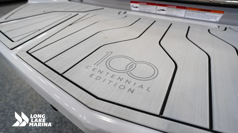 Slide: The Image of 2025 Nautique G23 Centennial Edition boat deck at Long Lake Marina. - 8