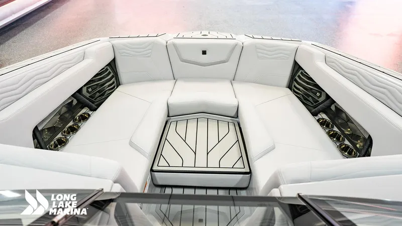 Slide: The Image of Luxurious interior of 2025 Nautique G23 boat with sleek white seating and modern design. - 9