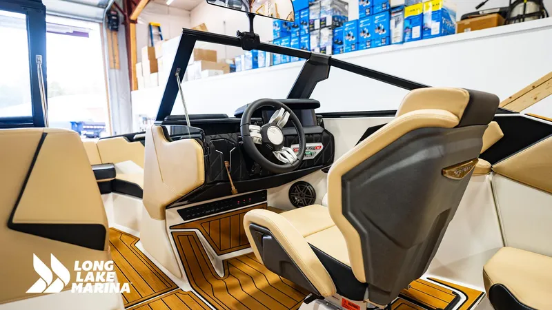 Slide: The Image of 2024 Nautique S21 boat interior with modern dashboard and seating at Long Lake Marina. - 4