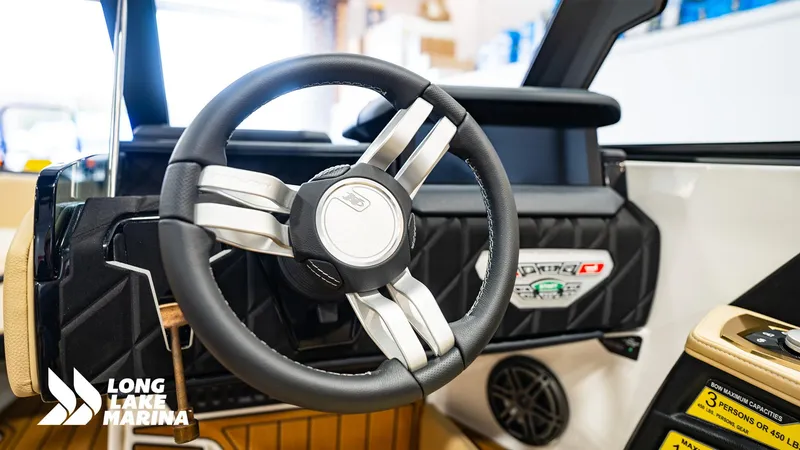 Slide: The Image of 2024 Nautique S21 steering wheel and dashboard at Long Lake Marina. - 8