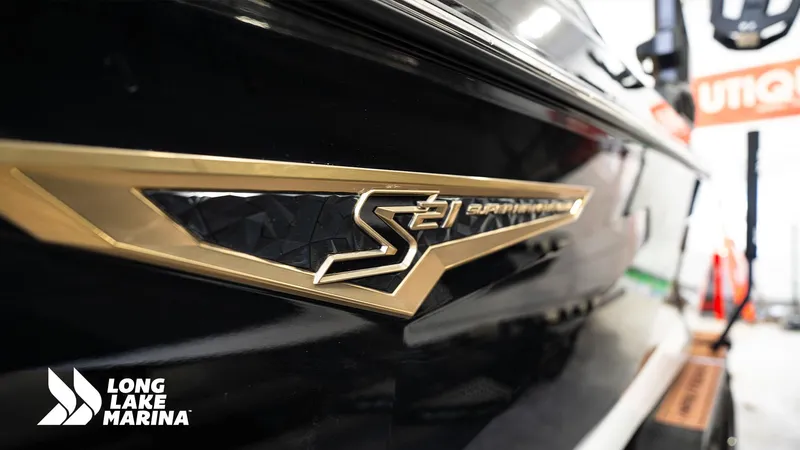 Slide: The Image of 2024 Nautique S21 boat emblem at Long Lake Marina, showcasing sleek design details. - 9