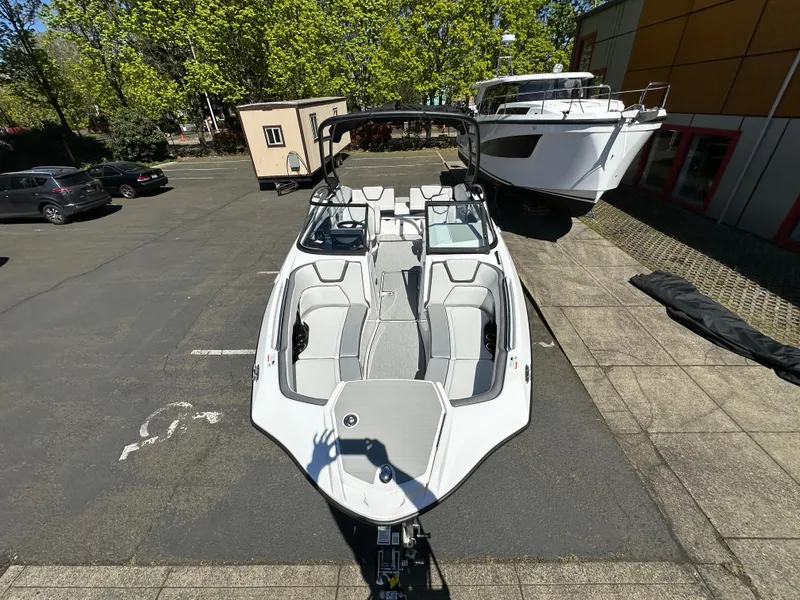 Slide: The Image of 2024 Yamaha Boats AR250 in a parking lot, showcasing sleek design and modern features. - 10