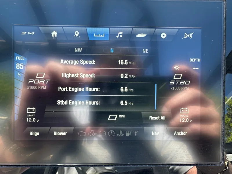 Slide: The Image of 2024 Yamaha Boats AR250 dashboard display showing speed, engine hours, and fuel level. - 24