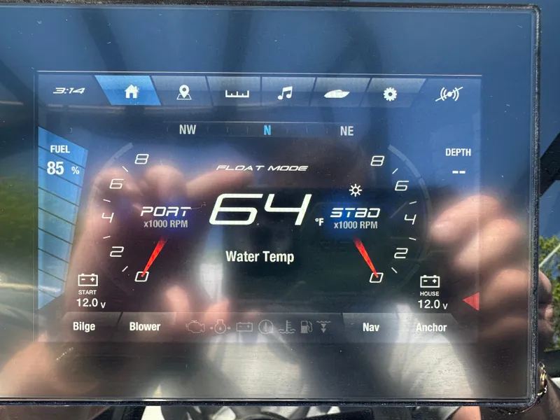 Slide: The Image of 2024 Yamaha Boats AR250 dashboard display showing water temperature and RPM gauges. - 25