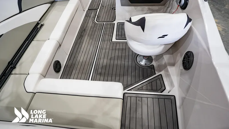 Slide: The Image of 2022 Starcraft SVX231 boat interior with cushioned seating and sleek flooring at Long Lake Marina. - 10