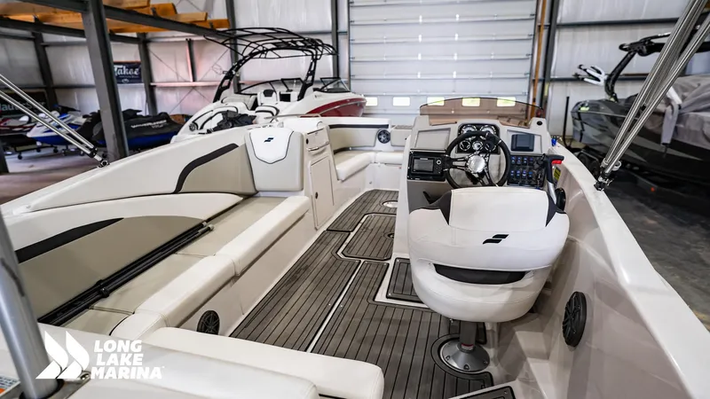 Slide: The Image of 2022 Starcraft SVX231 boat interior at Long Lake Marina, featuring modern seating and controls. - 3