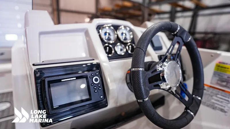 Slide: The Image of 2022 Starcraft SVX231 boat dashboard with steering wheel and navigation system at Long Lake Marina. - 8