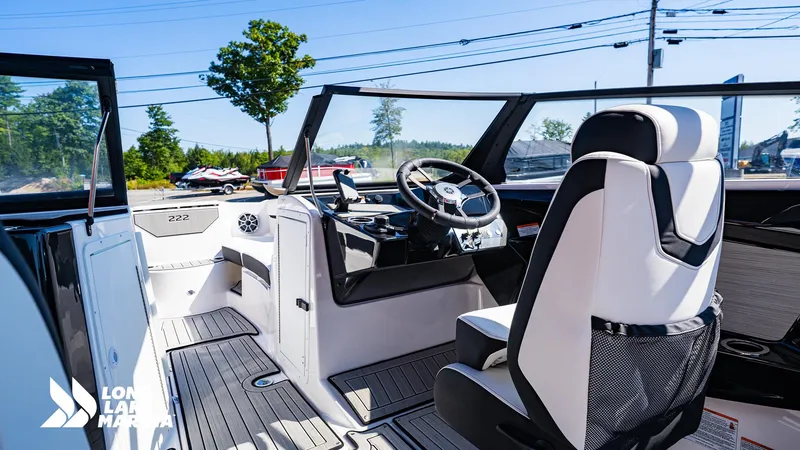Slide: The Image of 2025 Yamaha Boats 222S interior with sleek design and modern steering console. - 10