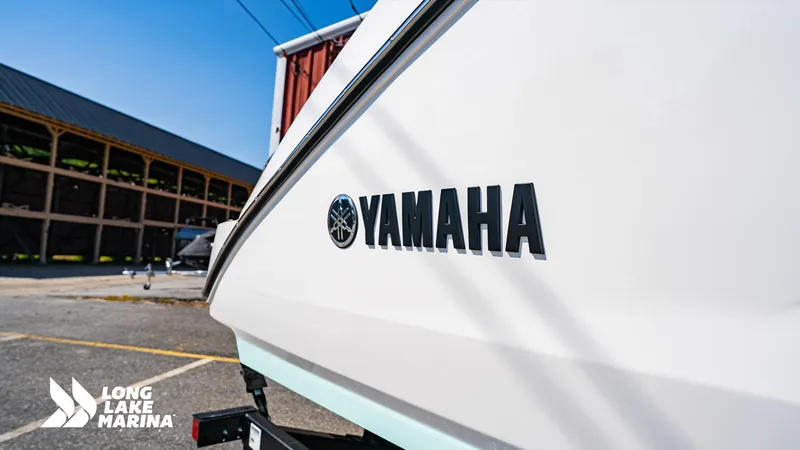 Slide: The Image of 2025 Yamaha Boats 222S at Long Lake Marina, showcasing sleek design and branding. - 14