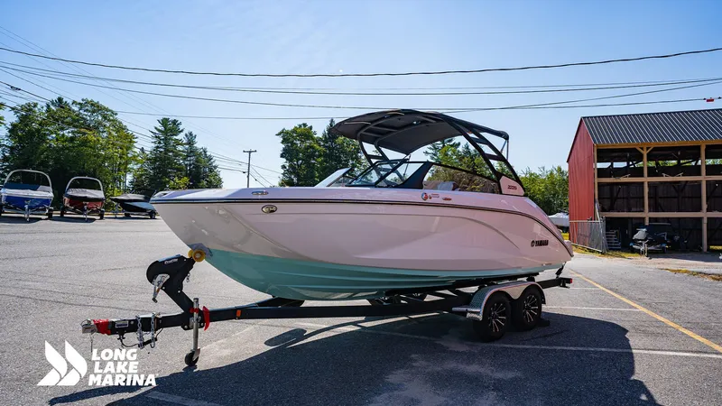 Slide: The Image of 2025 Yamaha Boats 222S on trailer at Long Lake Marina, sunny day. - 5