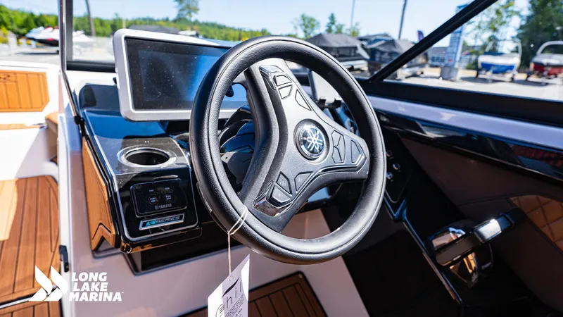 Slide: The Image of 2025 Yamaha Boats 252SD steering wheel and dashboard at Long Lake Marina. - 11