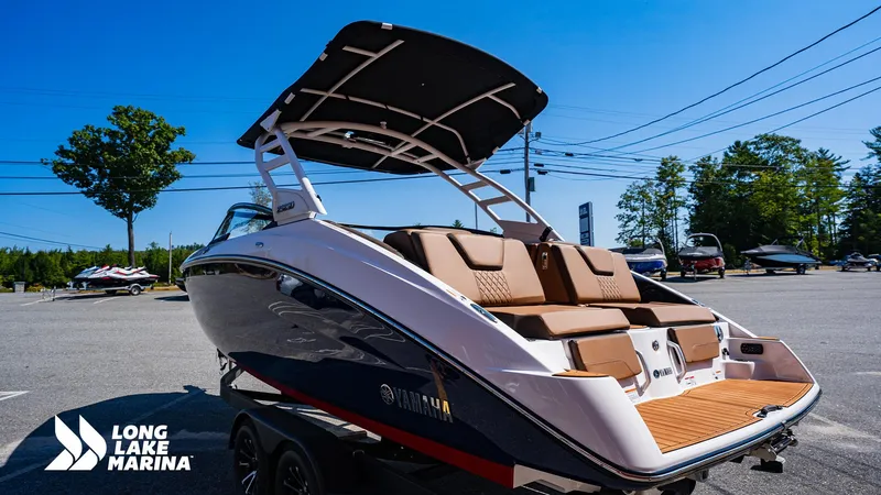 Slide: The Image of 2025 Yamaha Boats 252SD at Long Lake Marina, showcasing sleek design and comfortable seating. - 2